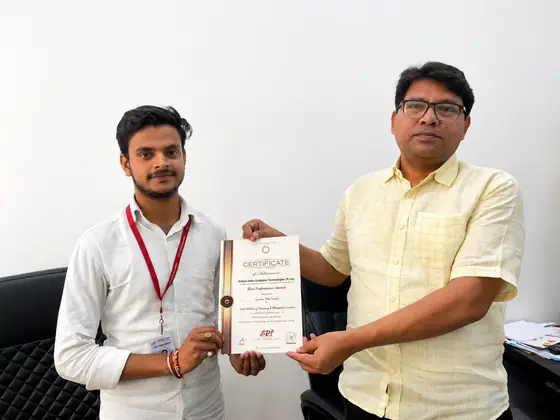 Two men holding a SSS certificate of achievement between them for the camera